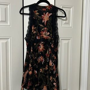 Free people black tie-back, mini dress/tunic with floral print and lace detail.